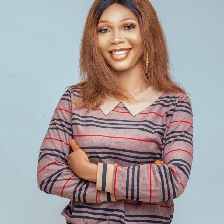 Kaveri Mehta, Lead Design Curator at CanvasValleyForge, reviewing corporate floral arrangements